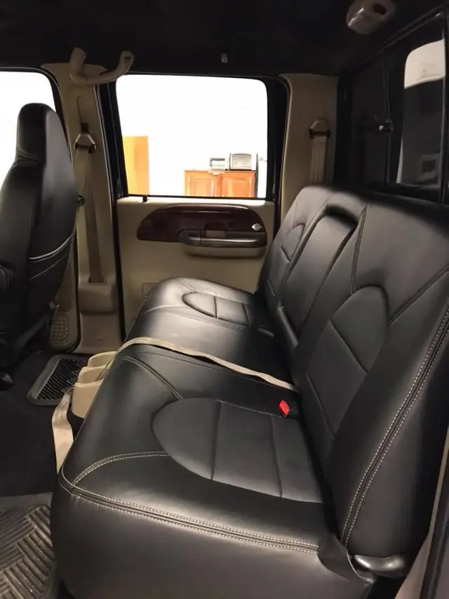 A crew-cab rear bench in black leather.