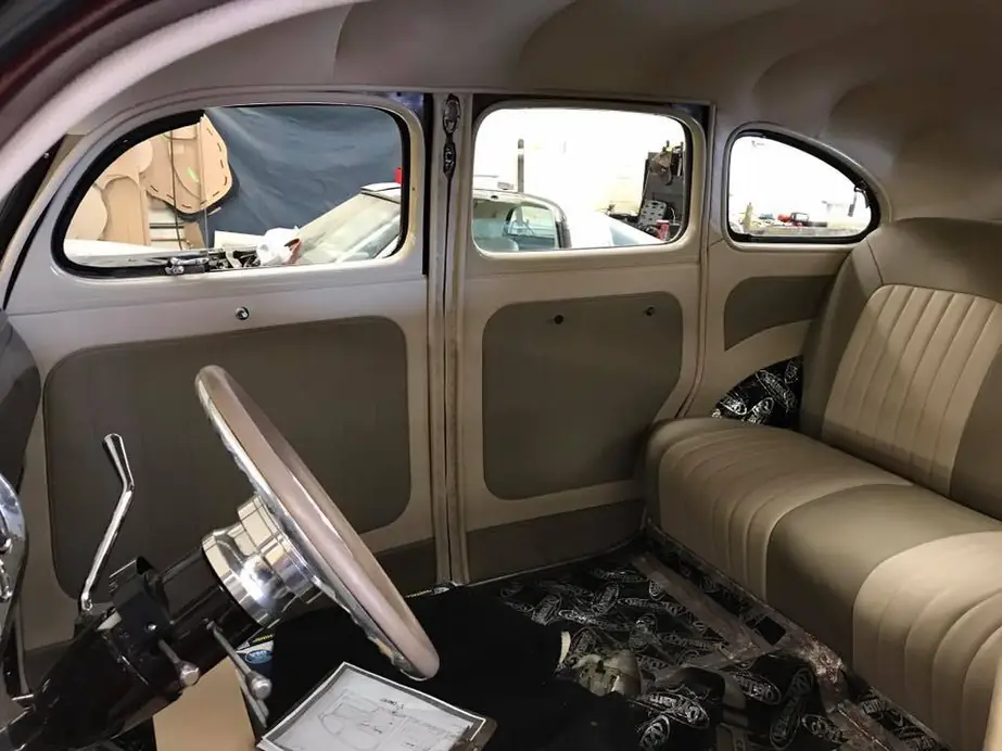 Vintage sedan with a new taupe headliner, door panels and bench seat