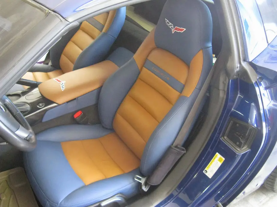 Corvette seats re-covered in blue and tan leather with embroidered script